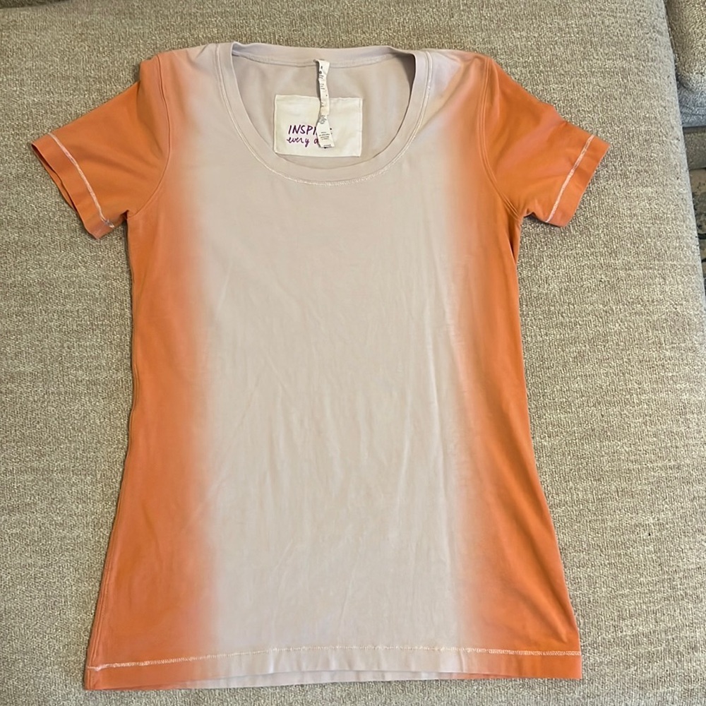 Lululemon orange and white gradient tee. Good condition. Size 8